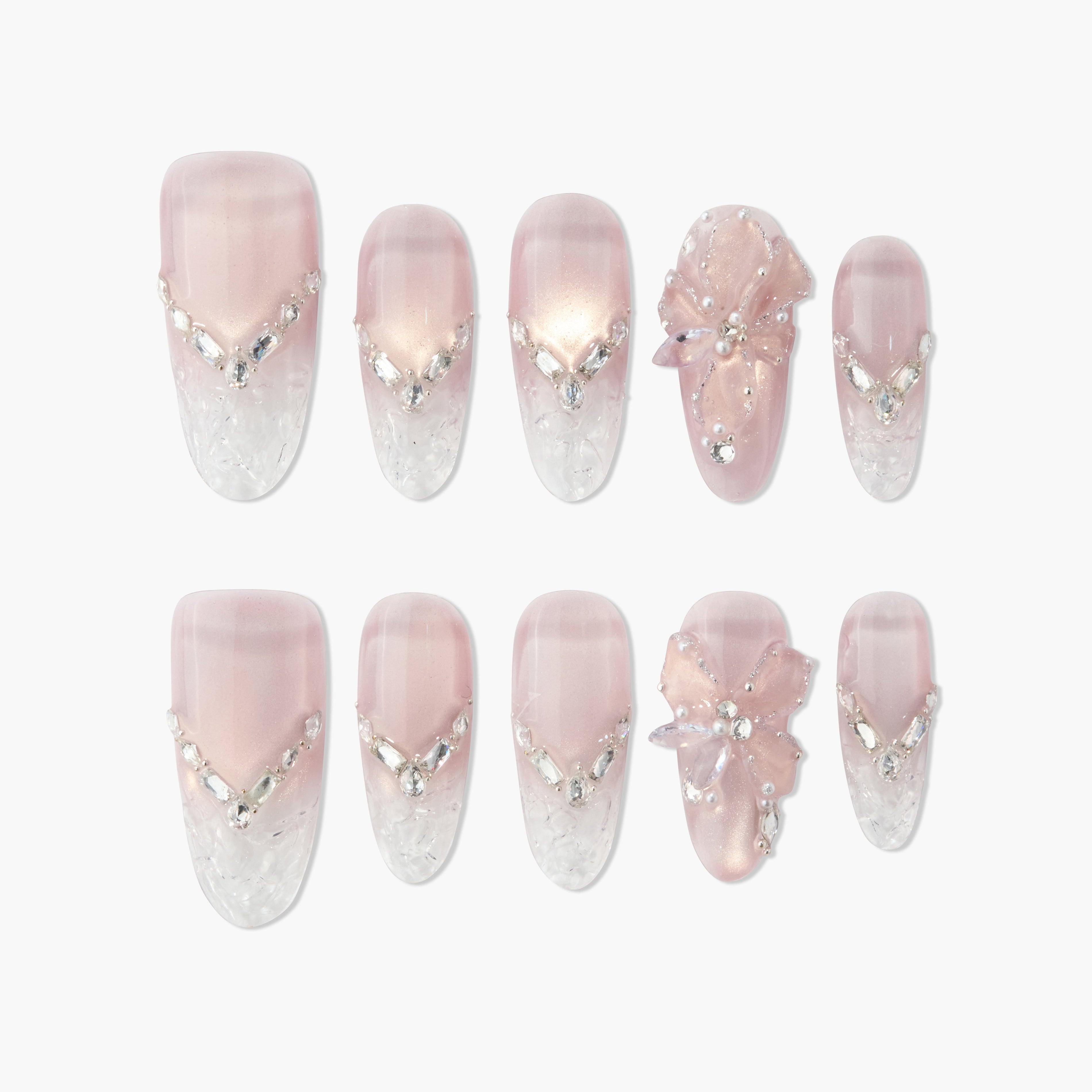 Handmade pink and white press-on nails with rhinestone accents and 3D floral design