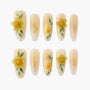 Yellow floral handmade press-on nails with 3D flower and leaf designs, elegant nude base