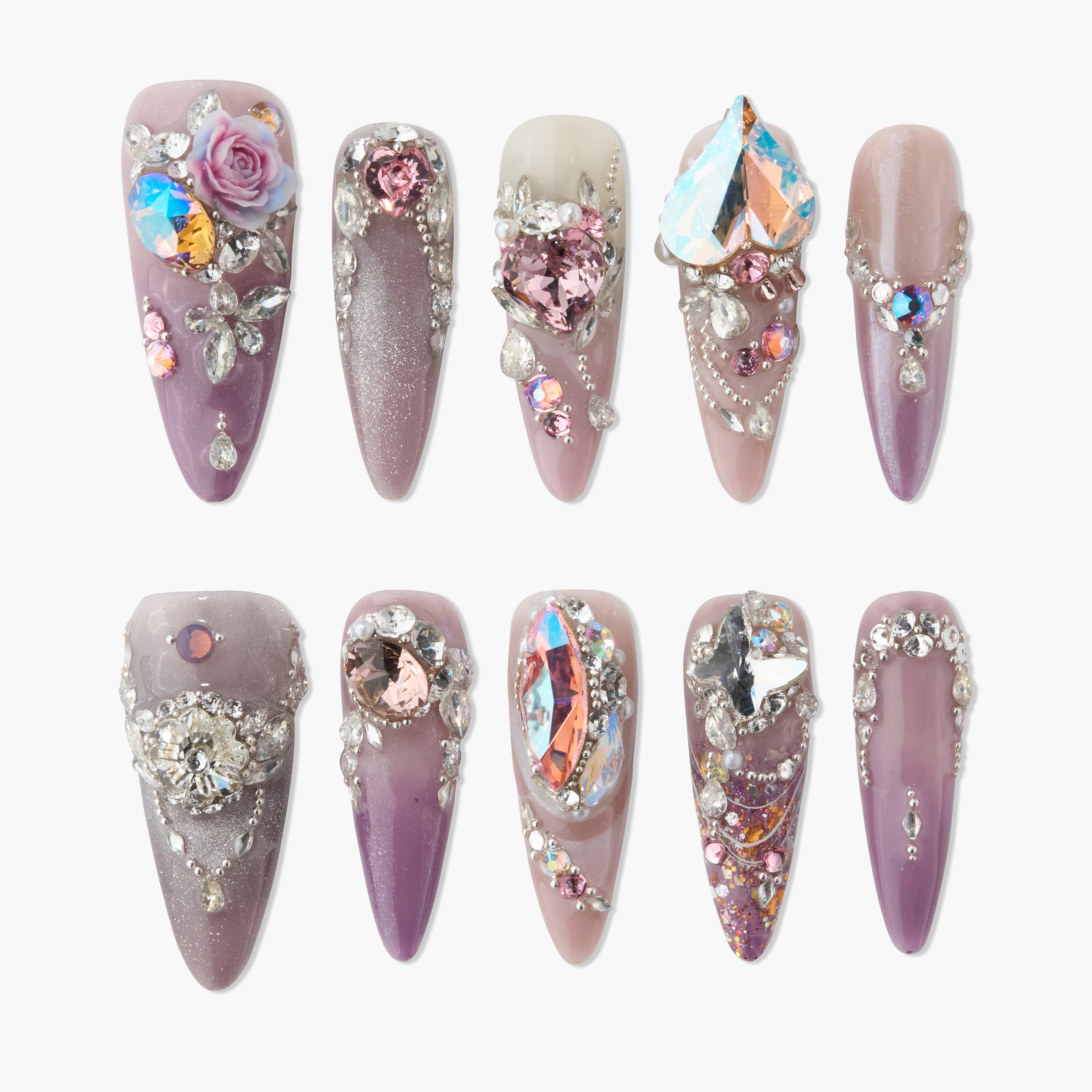 Handmade press-on nails with purple and nude tones, floral and crystal rhinestone accents