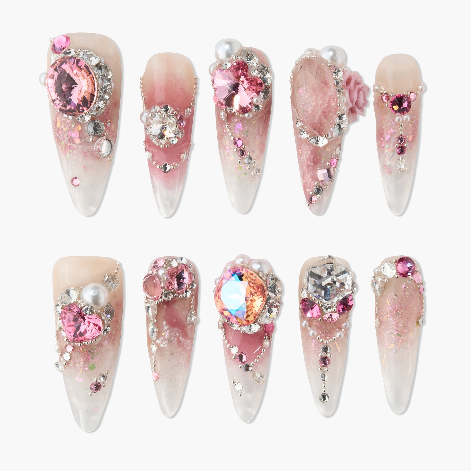 Handmade press-on nails with pink ombre, rhinestones, pearls, and 3D floral accents.