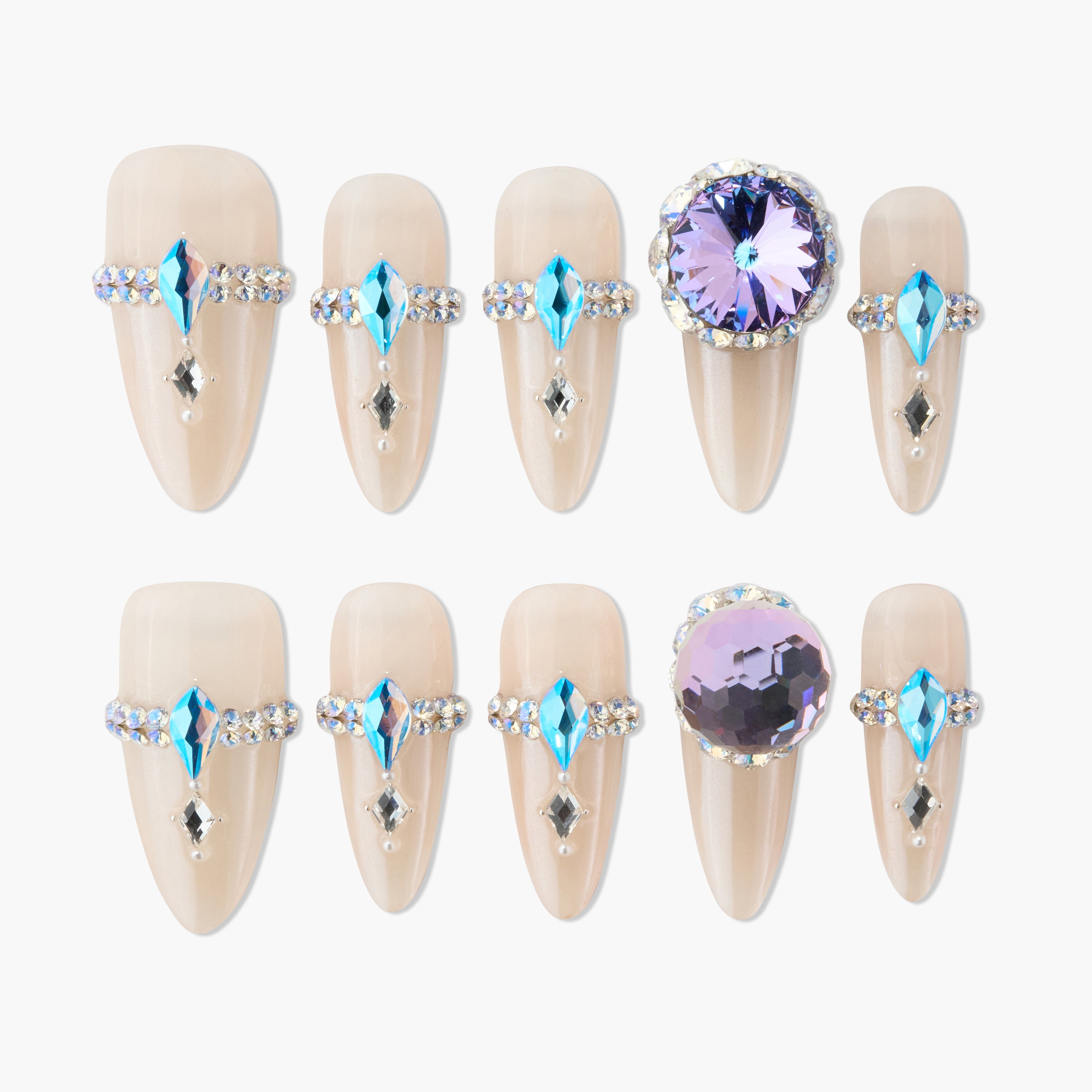 Handmade press-on nails with nude base, blue and crystal rhinestone accents, large purple gems