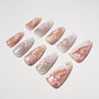 Handmade press-on nails in pink and silver with floral and feather designs