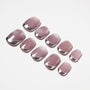Glossy pink press-on nails with silver chrome tips arranged on a white background