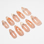 Almond-shaped press-on nails with gold glitter tips, pearl accents, and koi fish art