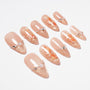 Handmade nude press-on nails with gold glitter tips, koi fish art, pearls, and rhinestones