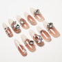 Handmade nude press-on nails with rhinestone and crystal 3D accents, long almond shape