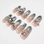Silver ombre press-on nails with rhinestone and gem 3D accents, luxury nail art design.