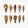Handmade brown press-on nails with 3D gold roses, gems, and pearl nail art accents