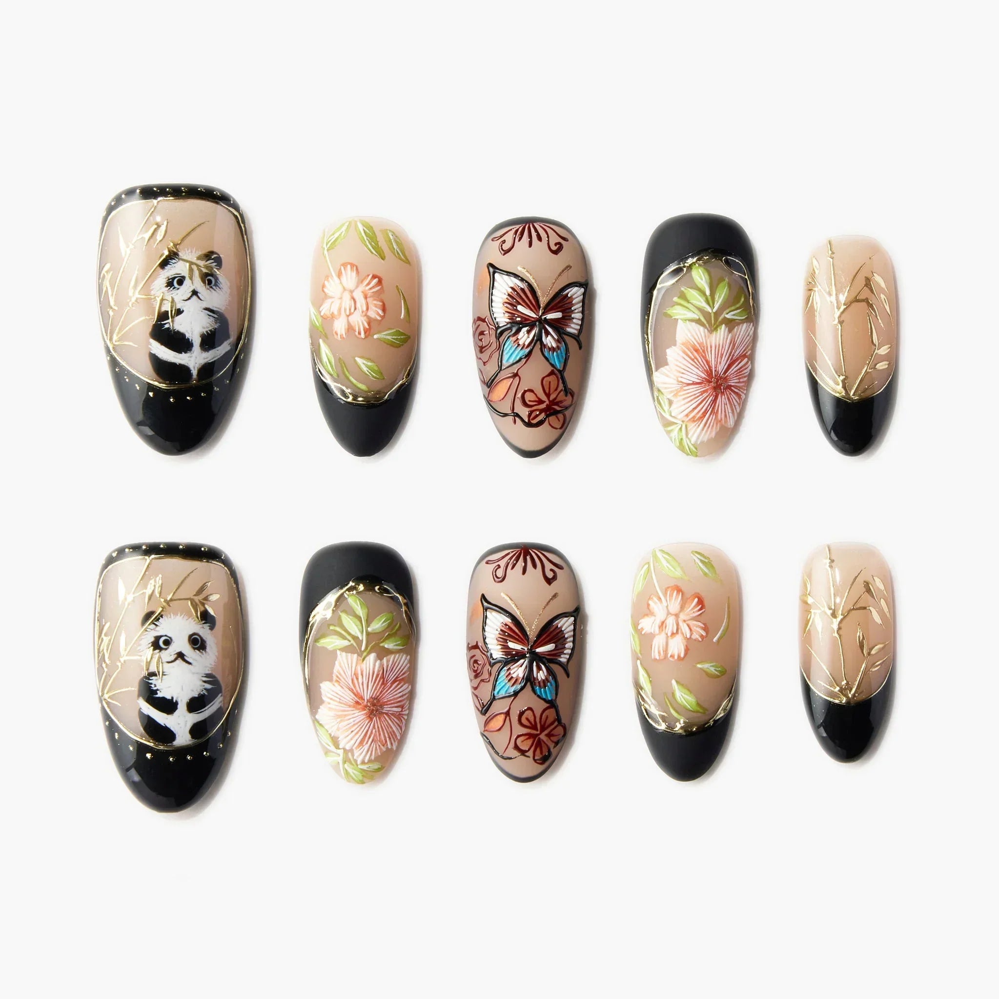Handmade press-on nails with panda, butterfly, flower, and bamboo designs on a nude base.