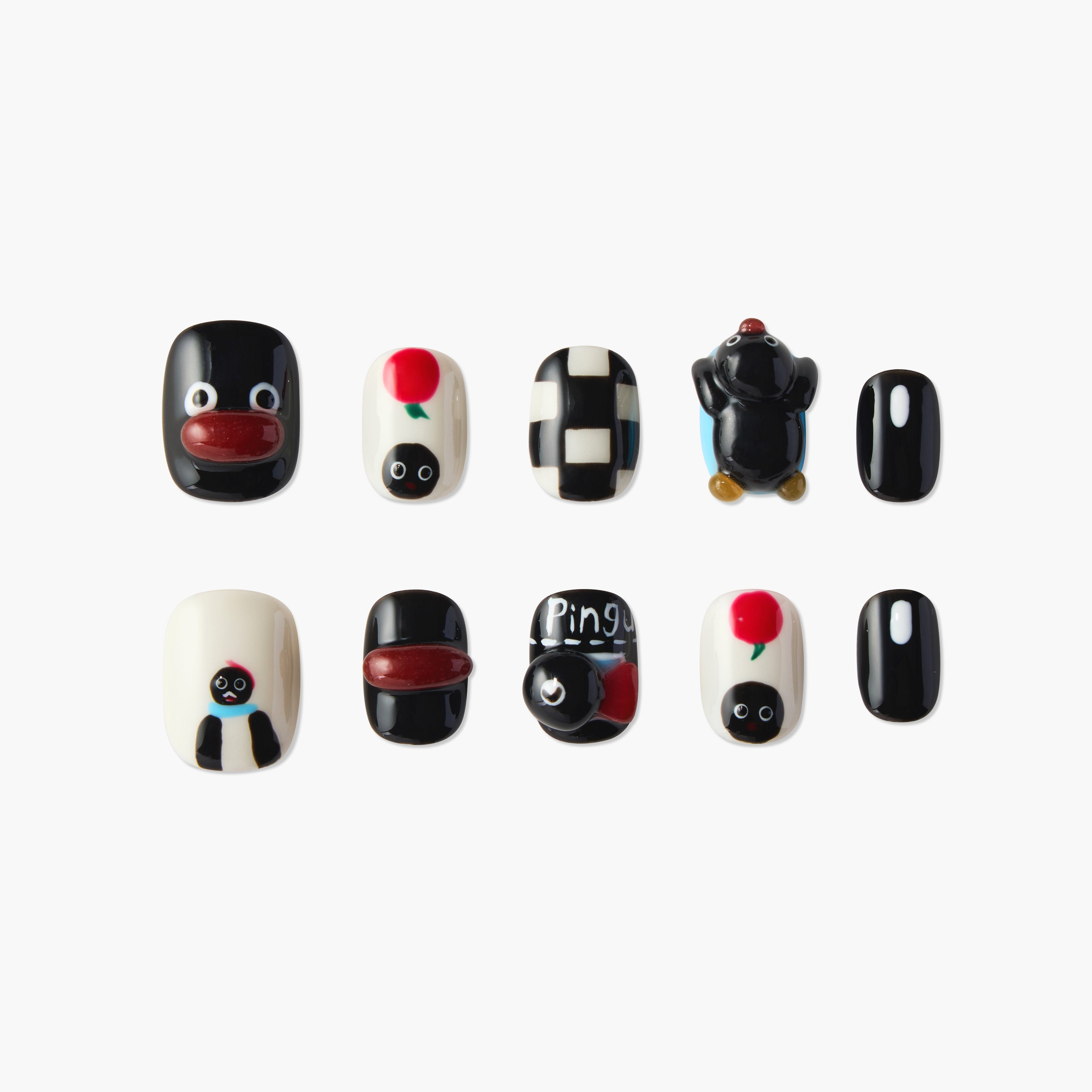 Handmade press-on nails with black, white, red designs and playful cartoon penguin art.