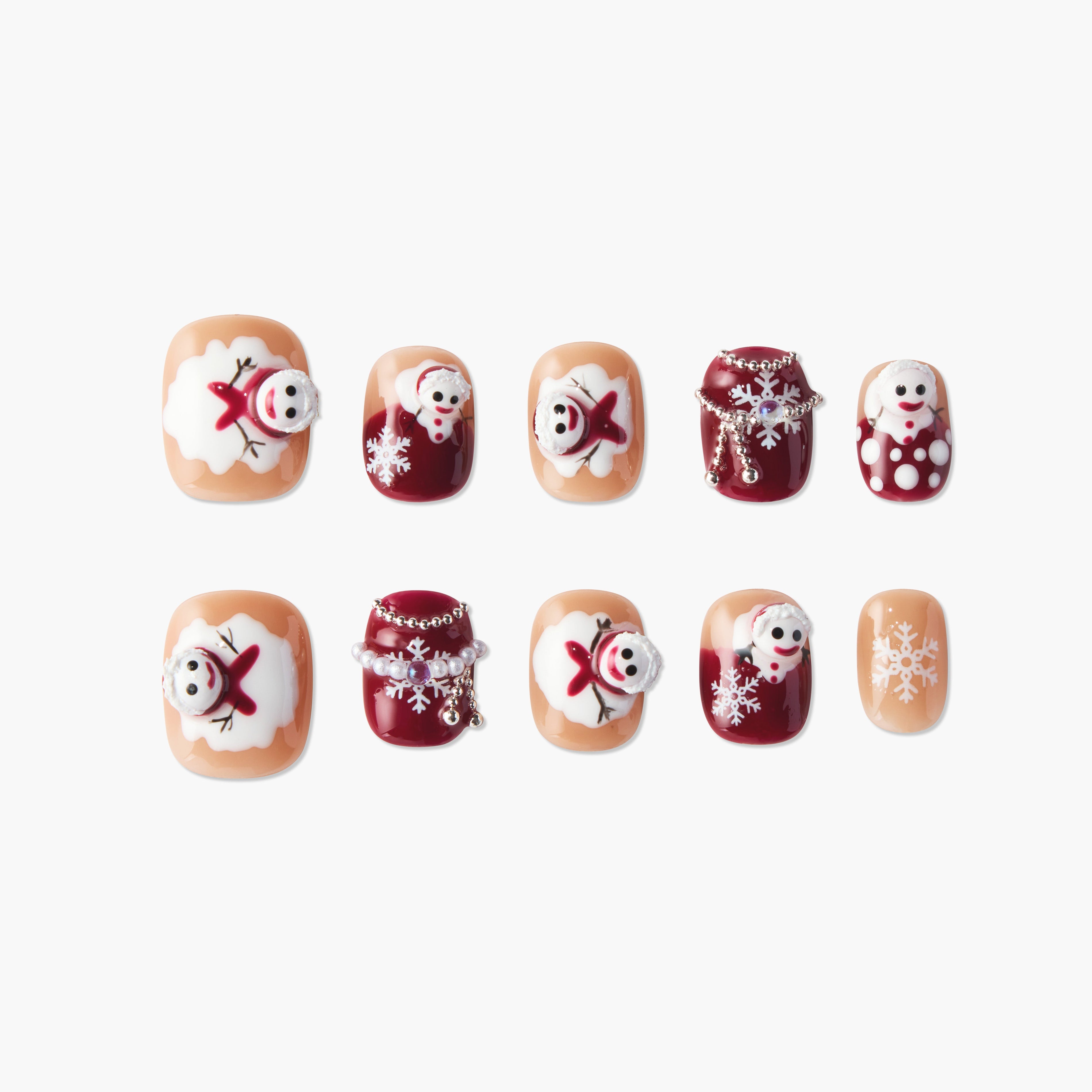 Handmade Christmas press-on nails with snowman and snowflake designs in red and nude tones