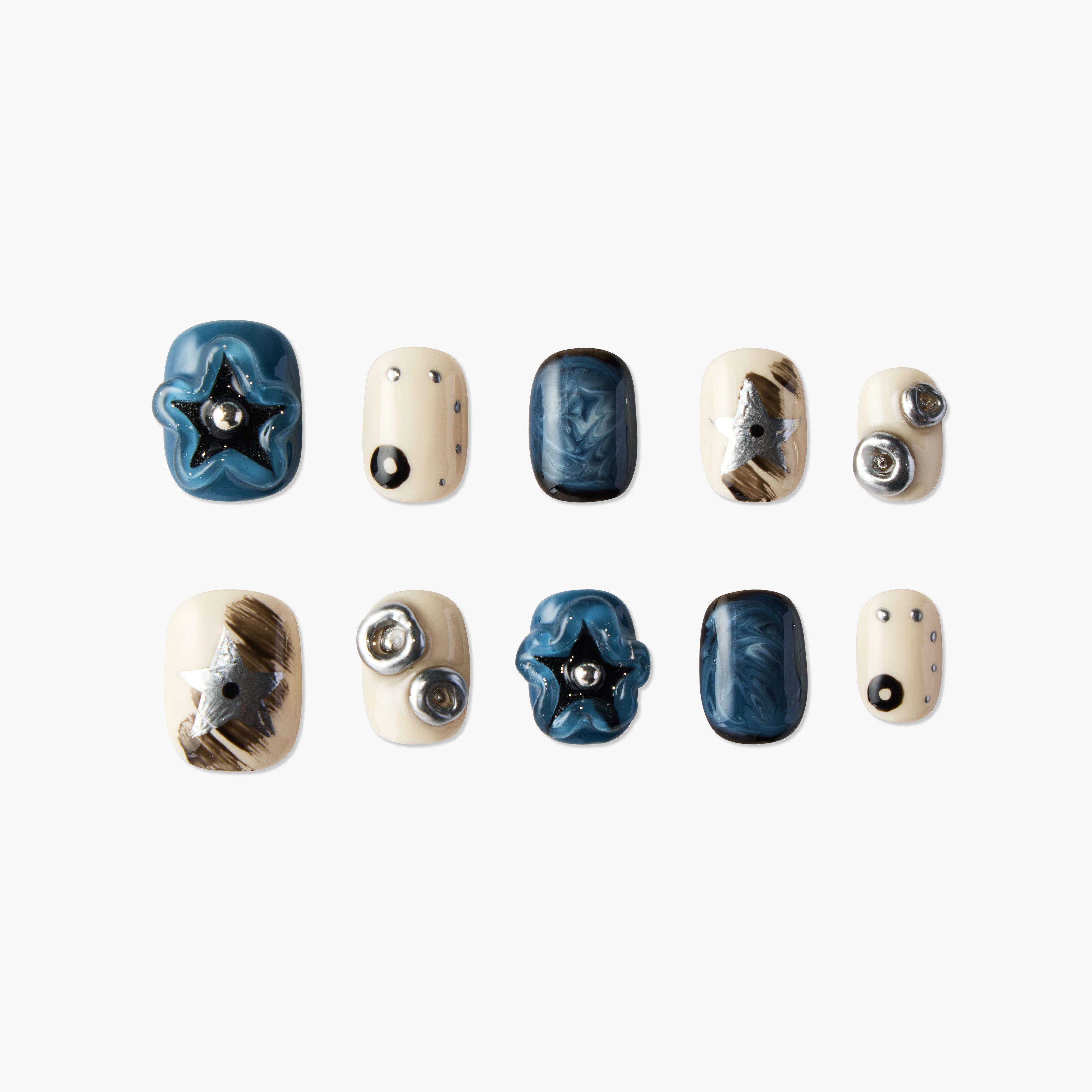 Blue and cream handmade press-on nails with 3D stars, metallic accents, and marbled designs.