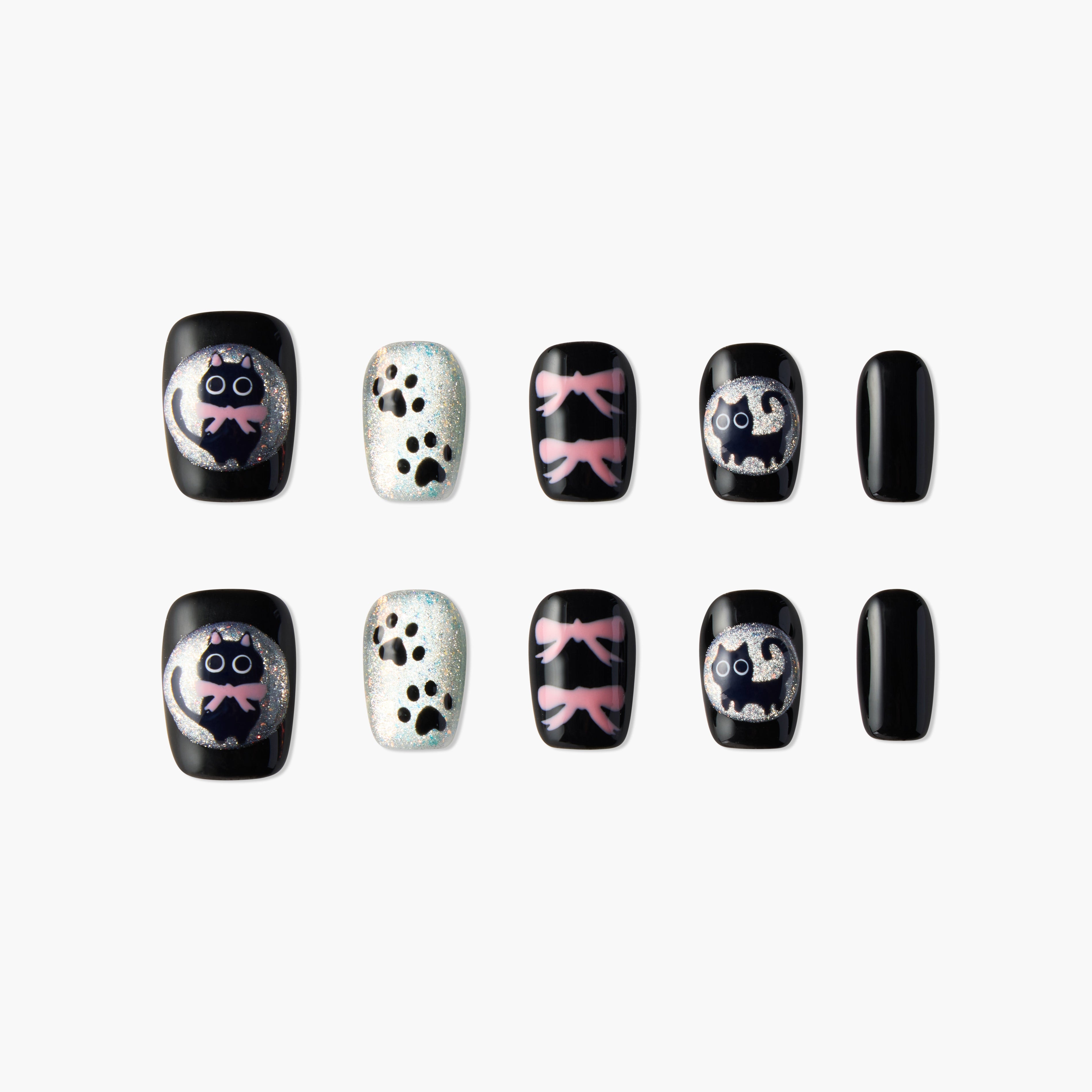 Handmade press-on nails with black cat, paw prints, pink bows, and glitter accents