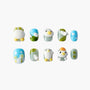 Handmade press-on nails with 3D bird designs, nature patterns, and pastel colors