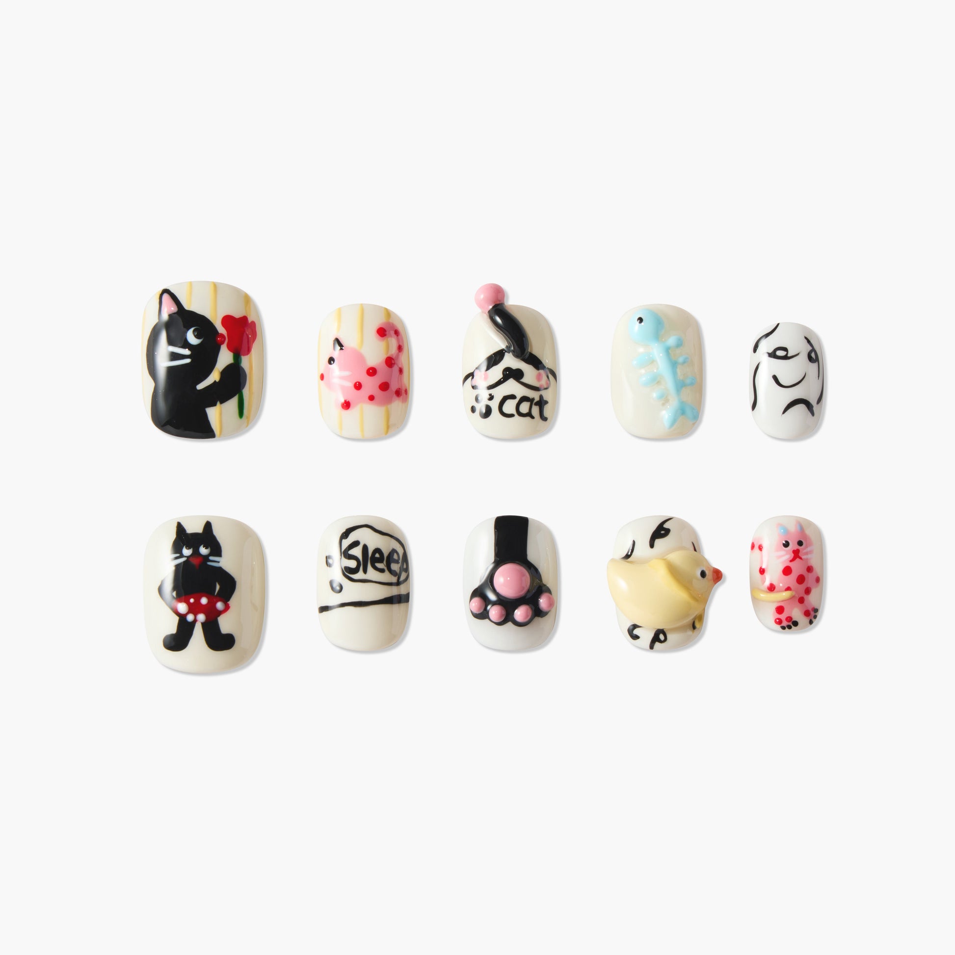 Handmade press-on nails with playful cat, paw, and fish designs in vibrant 3D art style