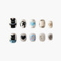 Handmade press-on nails with playful designs, featuring bears, hearts, bows, and pearl accents.