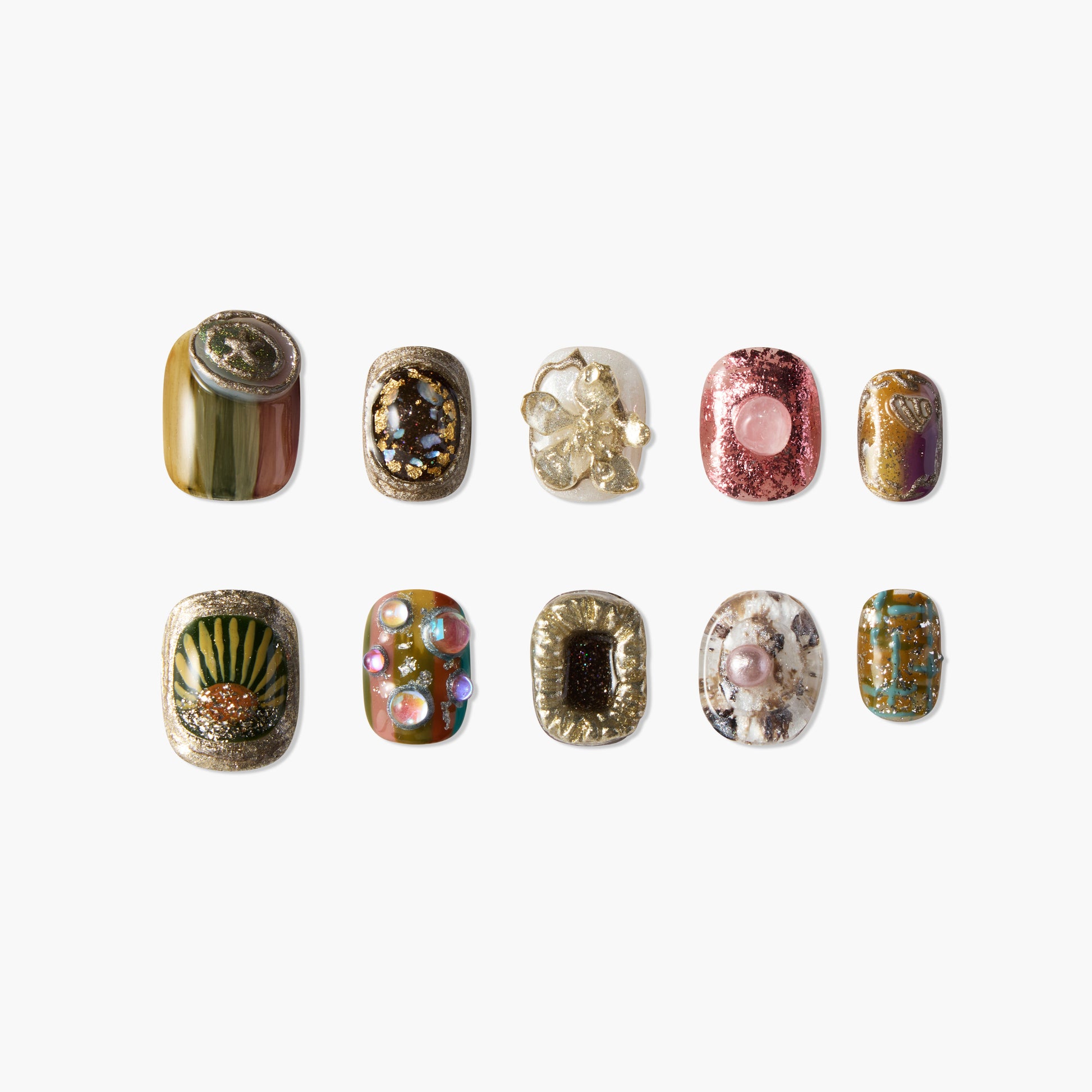 Ten handmade press-on nails with mixed gold, green, pink, and abstract gemstone designs.