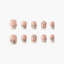 Handmade press-on nails with nude base, pearl tips, and silver rhinestone accents