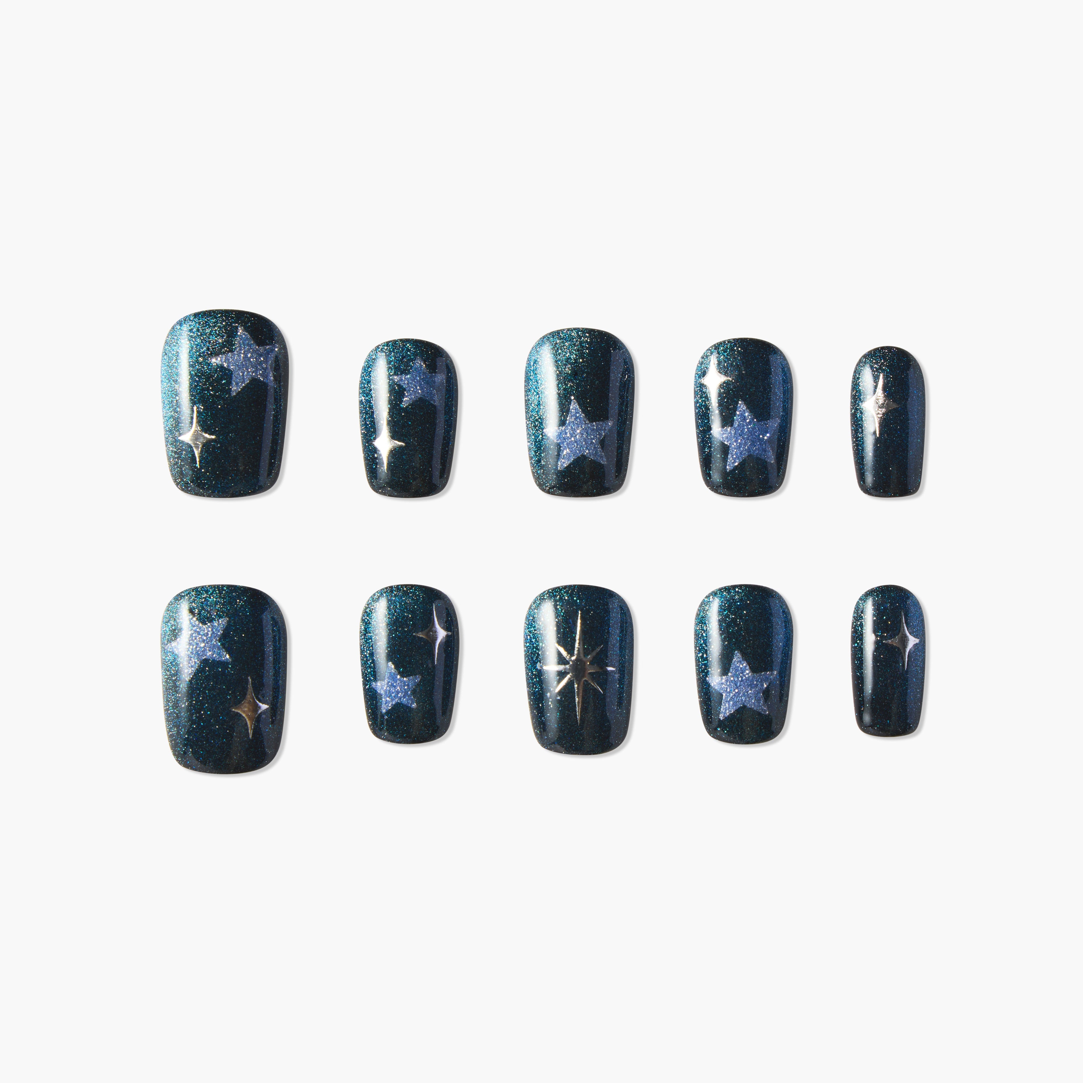 Handmade press-on nails with dark glitter base and silver star designs, set of ten