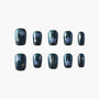Handmade press-on nails with dark glitter base and silver star designs, set of ten