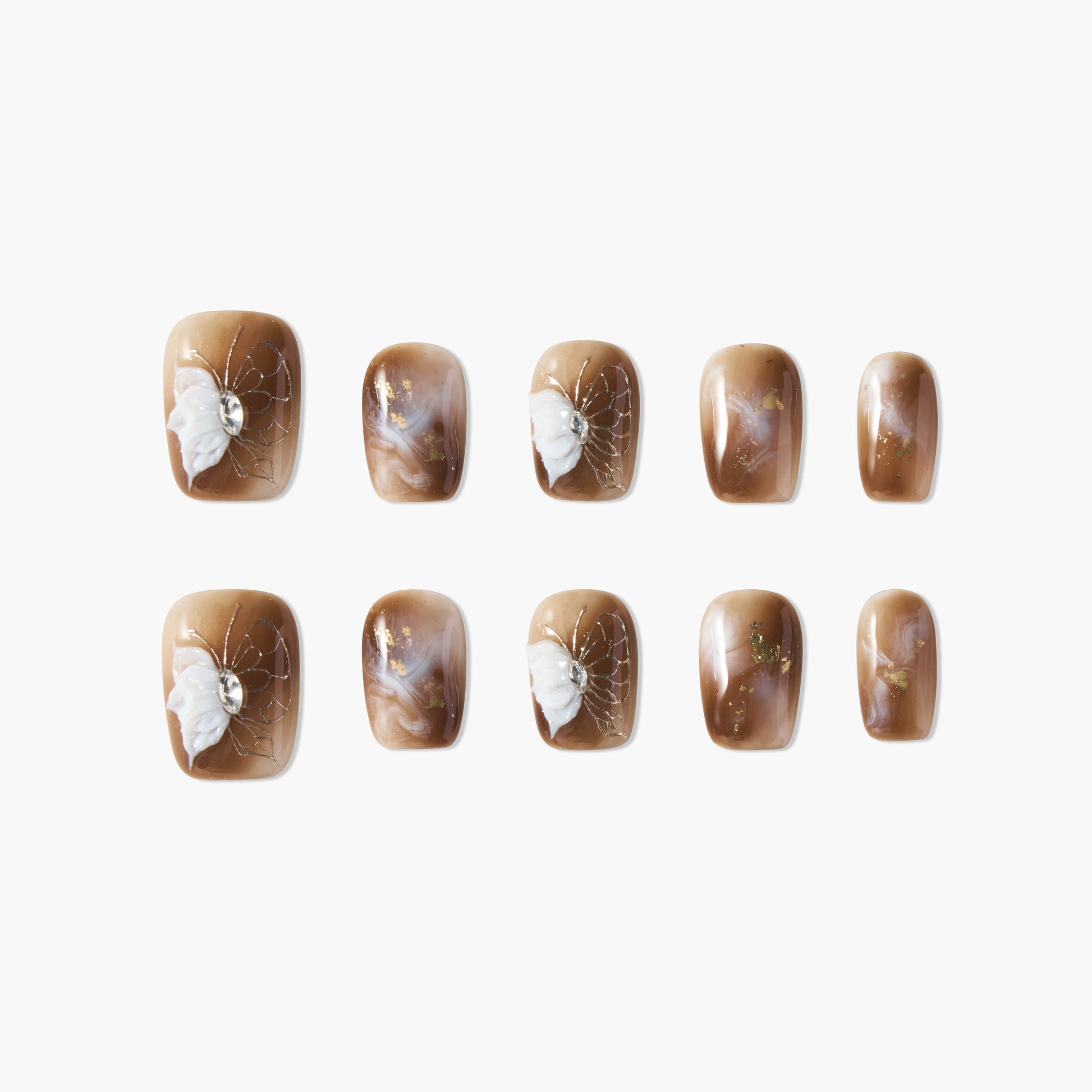 Brown marble press-on nails with white 3D butterfly and crystal accents, glossy finish