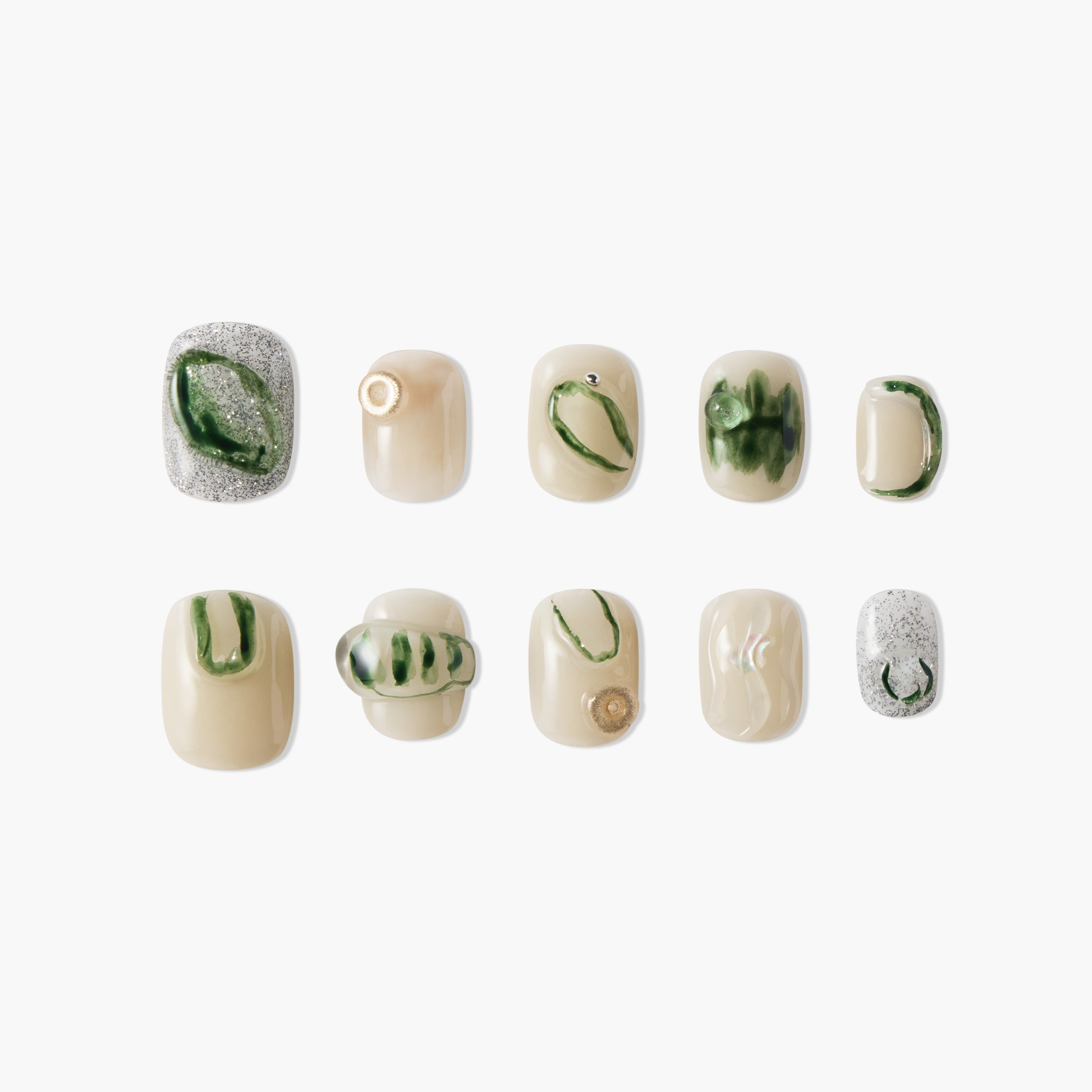 Handmade press-on nails with green marble accents, gold details, and glitter on nude base
