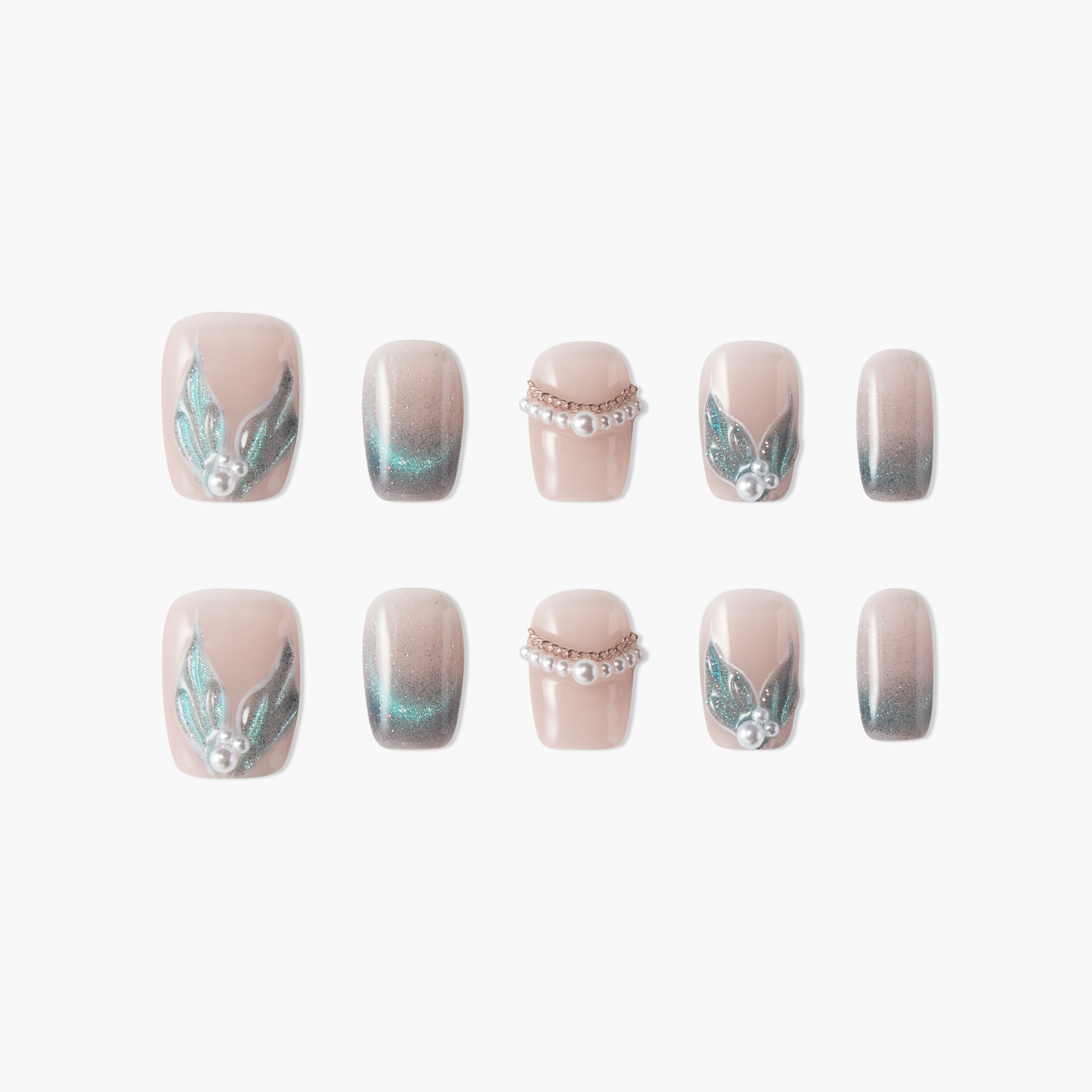 Handmade press-on nails with nude base, teal glitter accents, pearl and gem embellishments