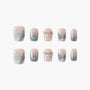 Handmade press-on nails with nude base, teal glitter accents, pearl and gem embellishments