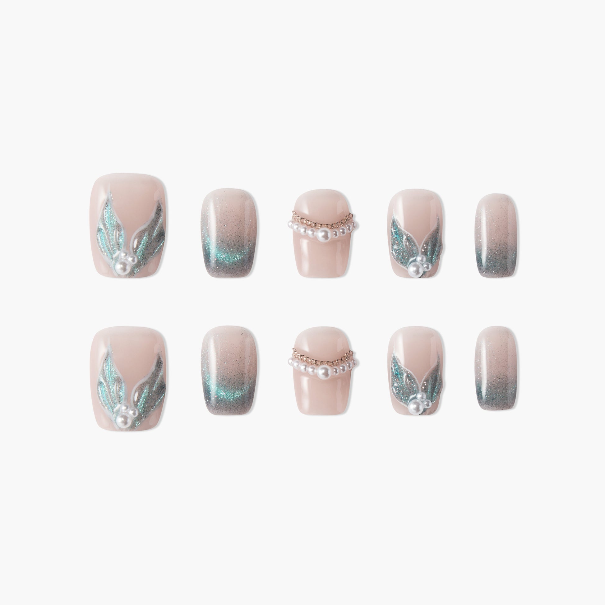 Handmade press-on nails with nude base, teal glitter accents, pearl and gem embellishments