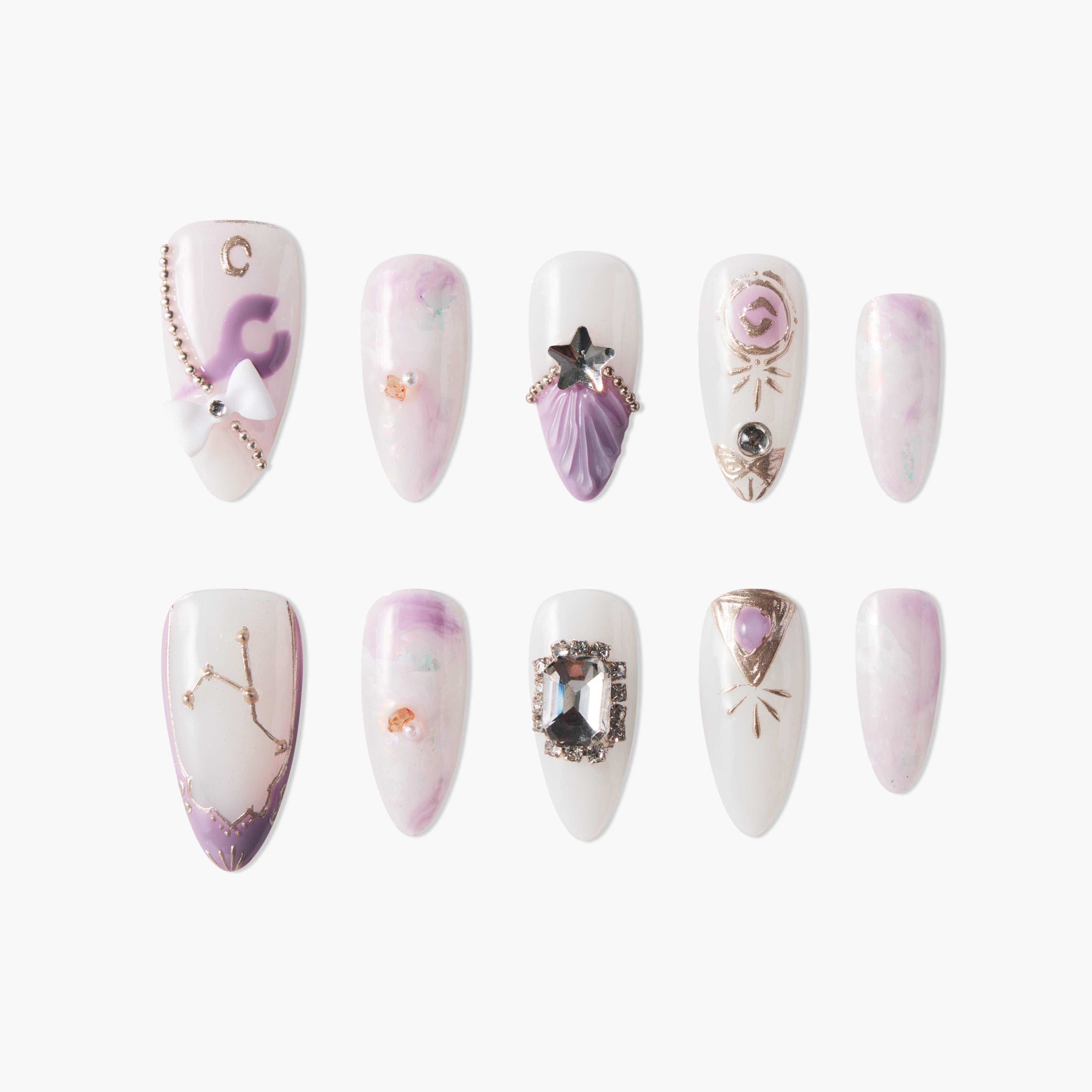 Handmade press-on nails with purple, white, and gold celestial designs and gemstone accents