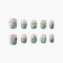 Green and nude ombre press-on nails with 3D butterfly and crystal accents, arranged in two rows
