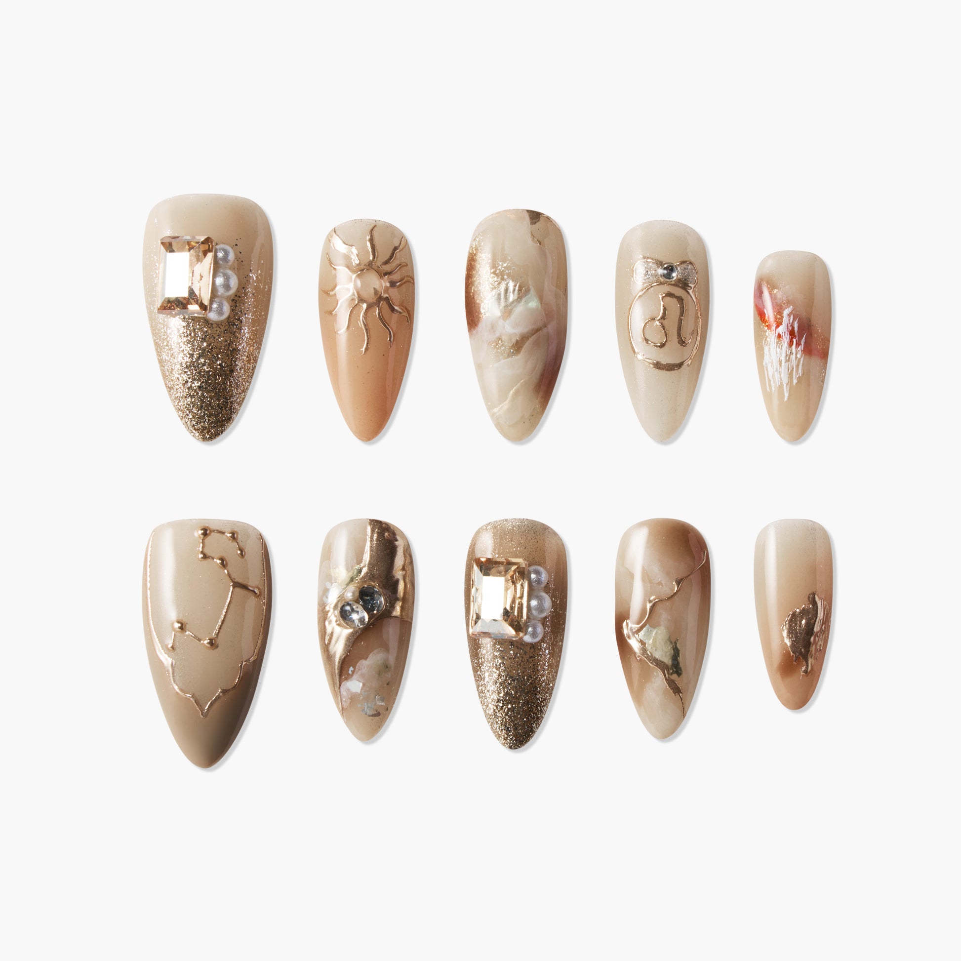 Set of handmade brown press-on nails with gold accents, pearl gems, and abstract designs.