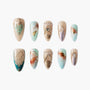 Handmade press-on nails with pastel marble design, gold accents, and gem embellishments