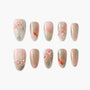 Pink and nude ombre press-on nails with 3D floral accents and koi fish designs