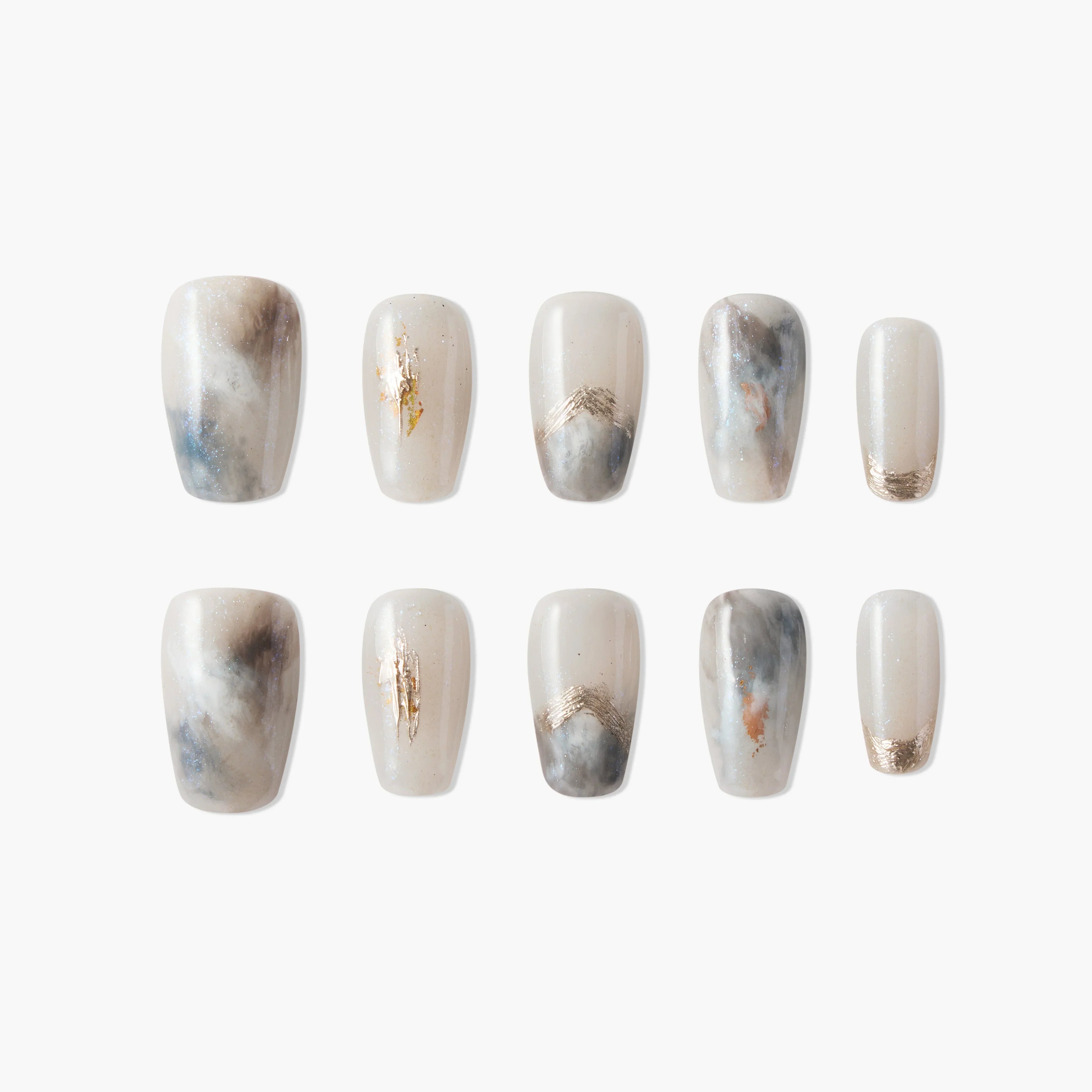 Set of marble-inspired press-on nails with gold foil and subtle grey, blue, and beige swirls.