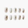 Handmade press-on nails with marble effect and gold foil accents, set of ten.