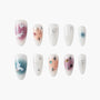 Handmade press-on nails set with bunny, bow, star, and floral nail art designs