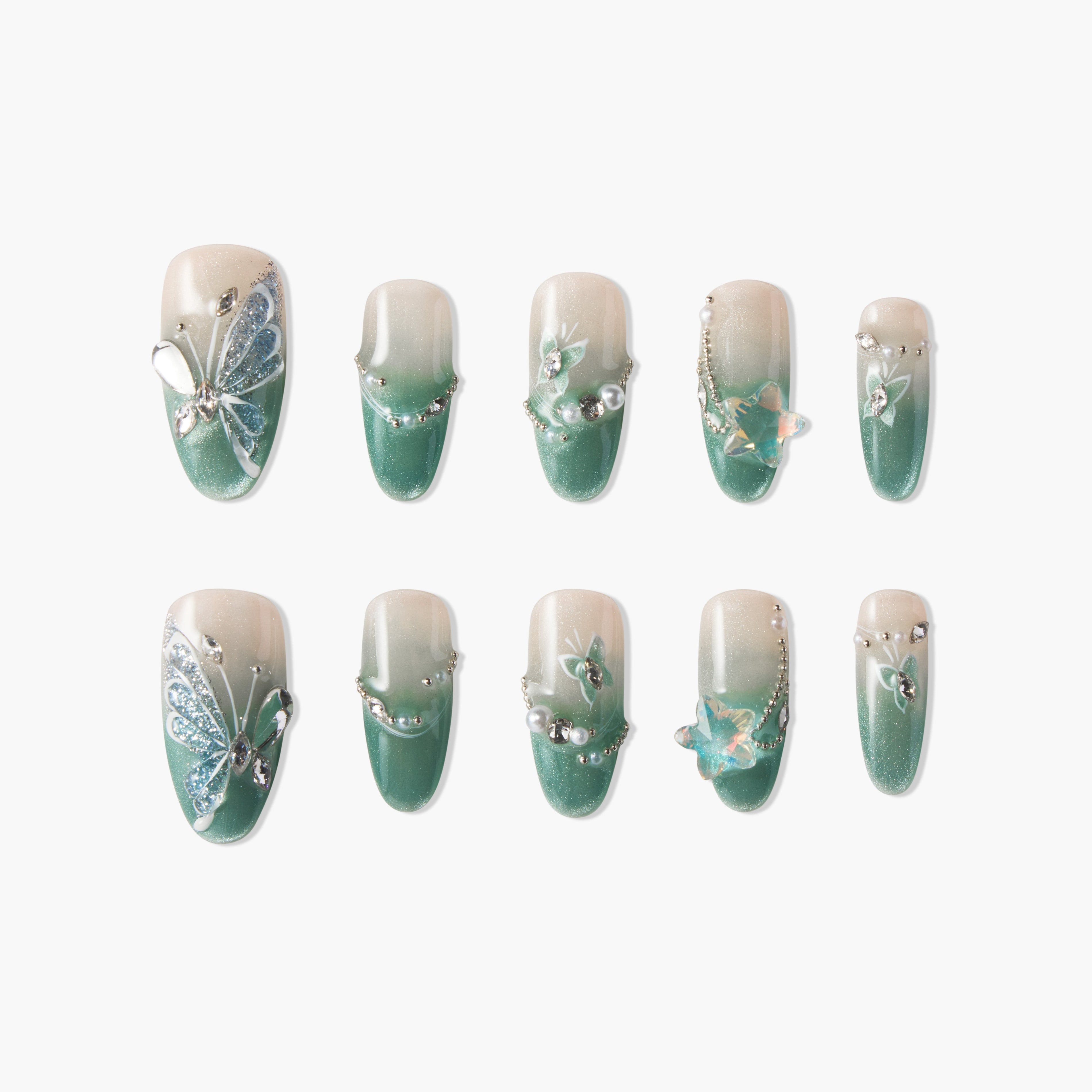 Green ombre press-on nails with butterfly, pearl, and gem 3D nail art accents