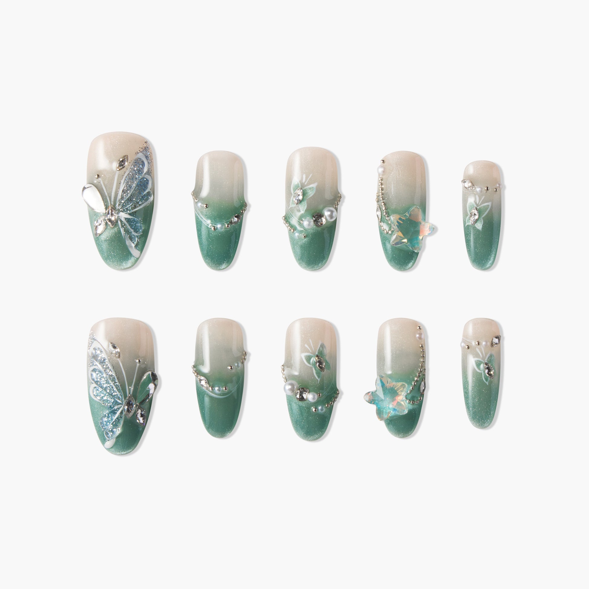 Green ombre press-on nails with butterfly, pearl, and gem 3D nail art accents