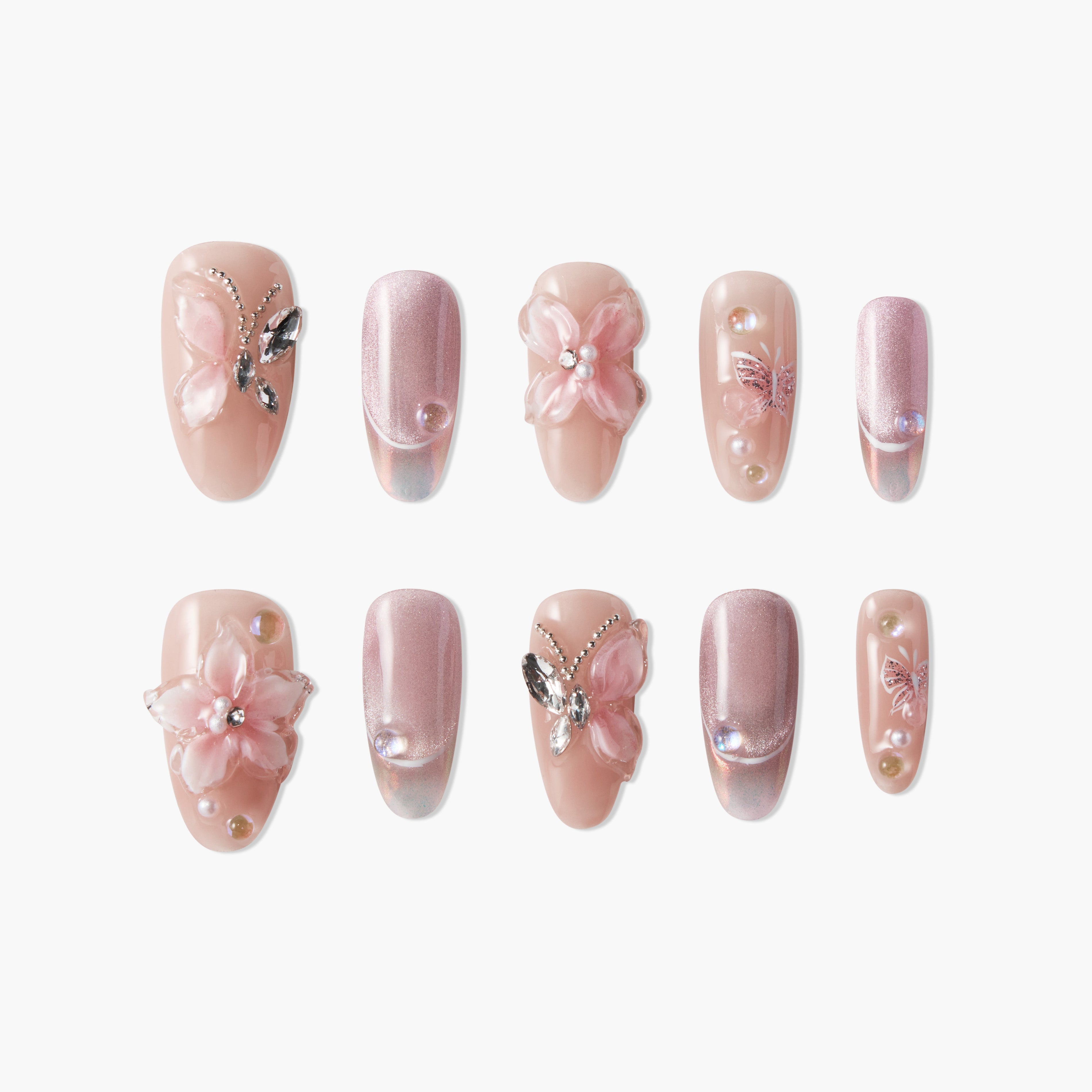 Handmade press-on nails in blush pink with 3D butterfly, pearl, and floral accents