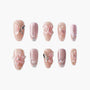 Handmade press-on nails in blush pink with 3D butterfly, pearl, and floral accents