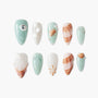 Ocean-themed handmade press-on nails with seashell, pearl, and starfish decorations