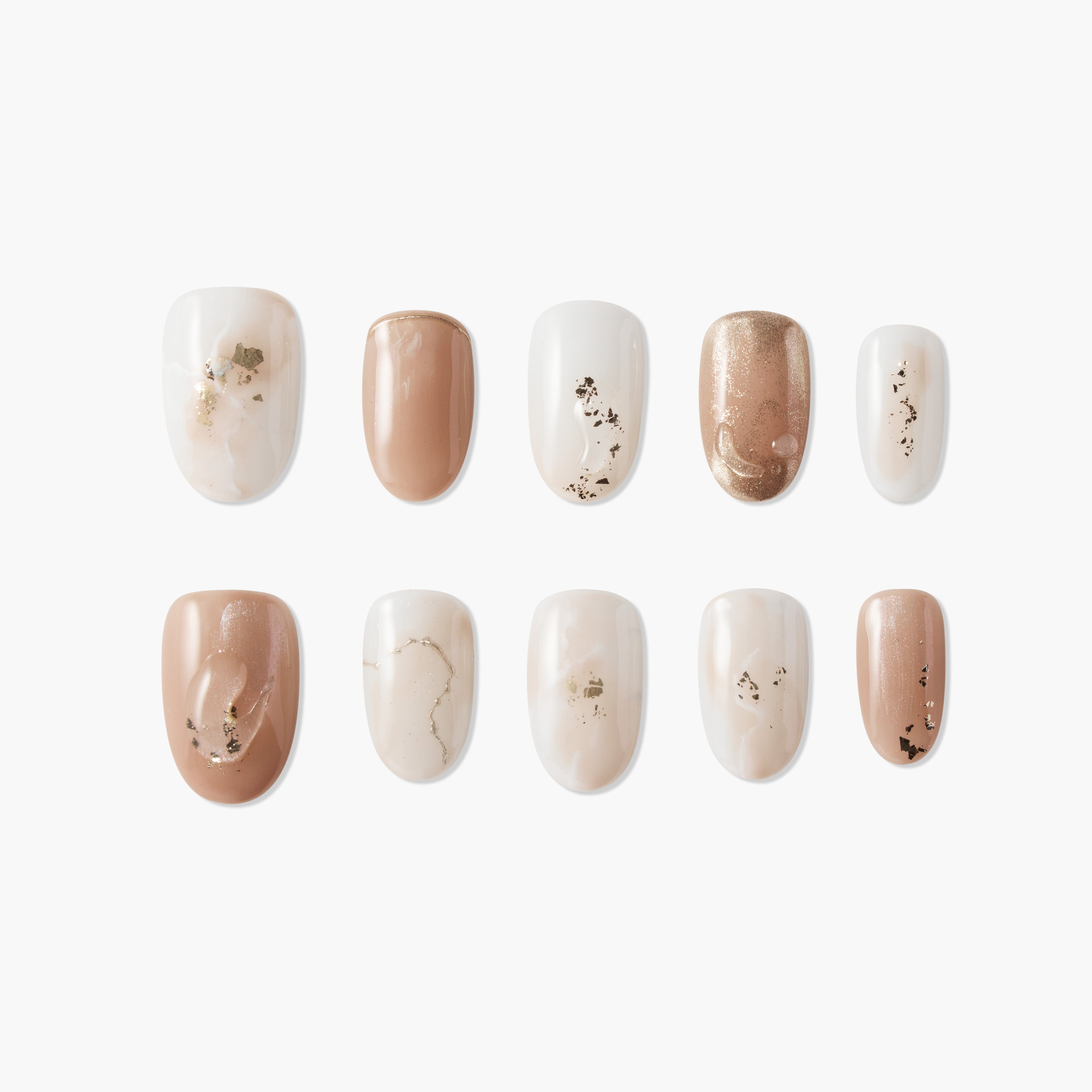 Handmade press-on nails in nude, white, marble, and gold foil designs displayed on white background