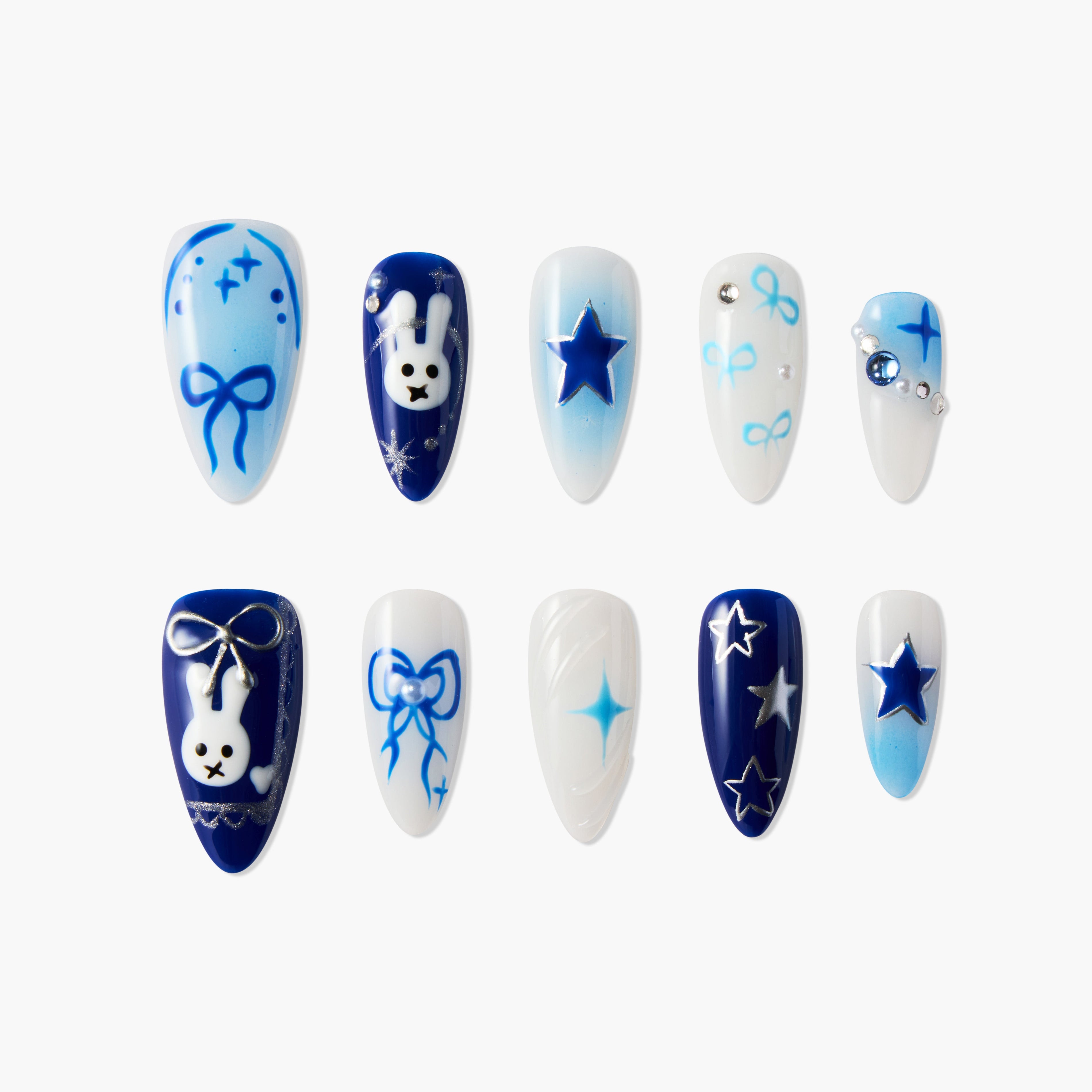 Blue and white handmade press-on nails with stars, bows, rhinestones, and bunny designs.