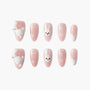 Cute pink press-on nails with 3D white bunny and bow designs, handmade nail art set