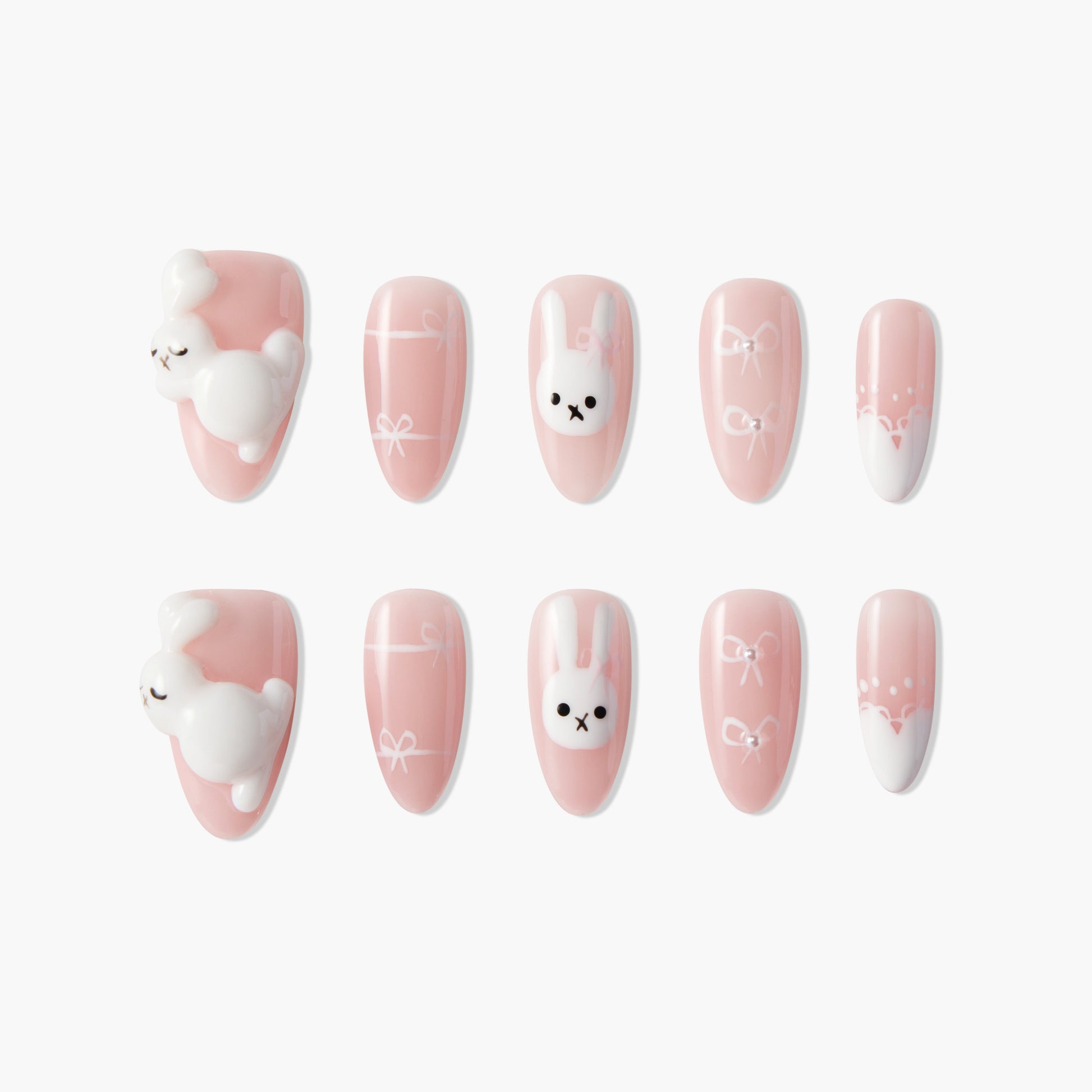 Cute pink press-on nails with 3D white bunny and bow designs, handmade nail art set