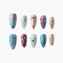 Handmade press-on nails set with glitter, blue and nude tones, rhinestones, bow and star designs