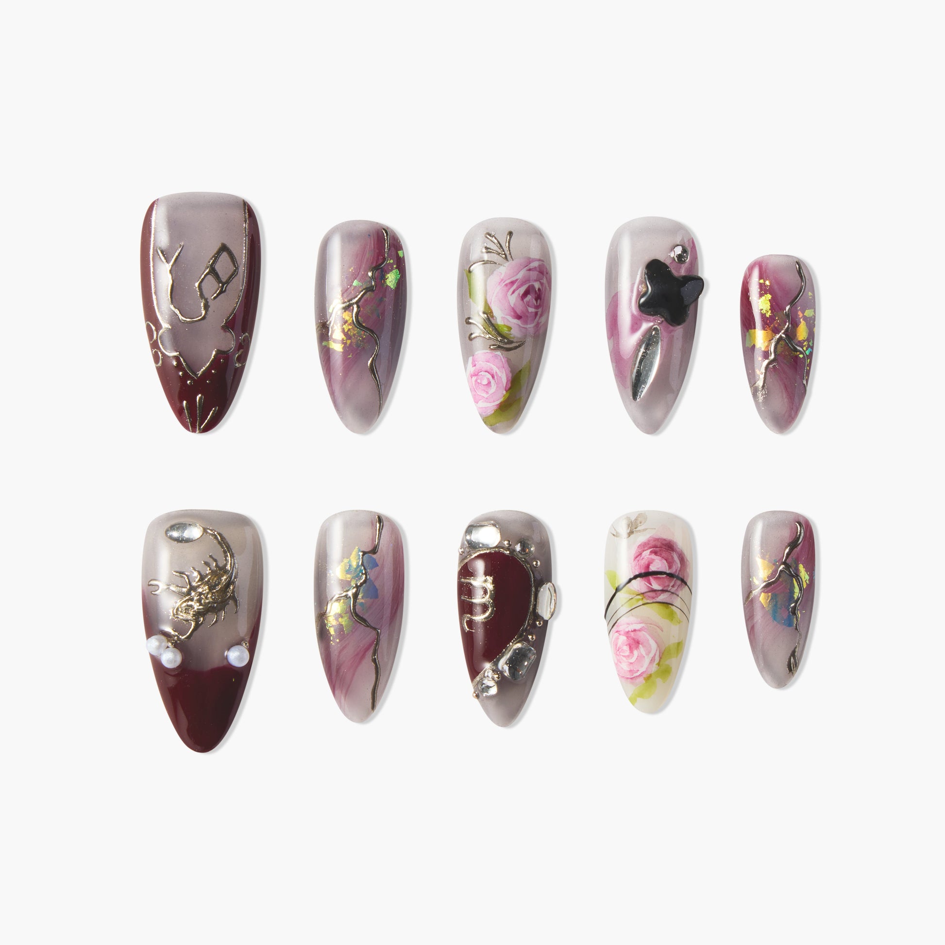 Handmade press-on nails with burgundy, pink floral designs, metallic accents, and 3D details.