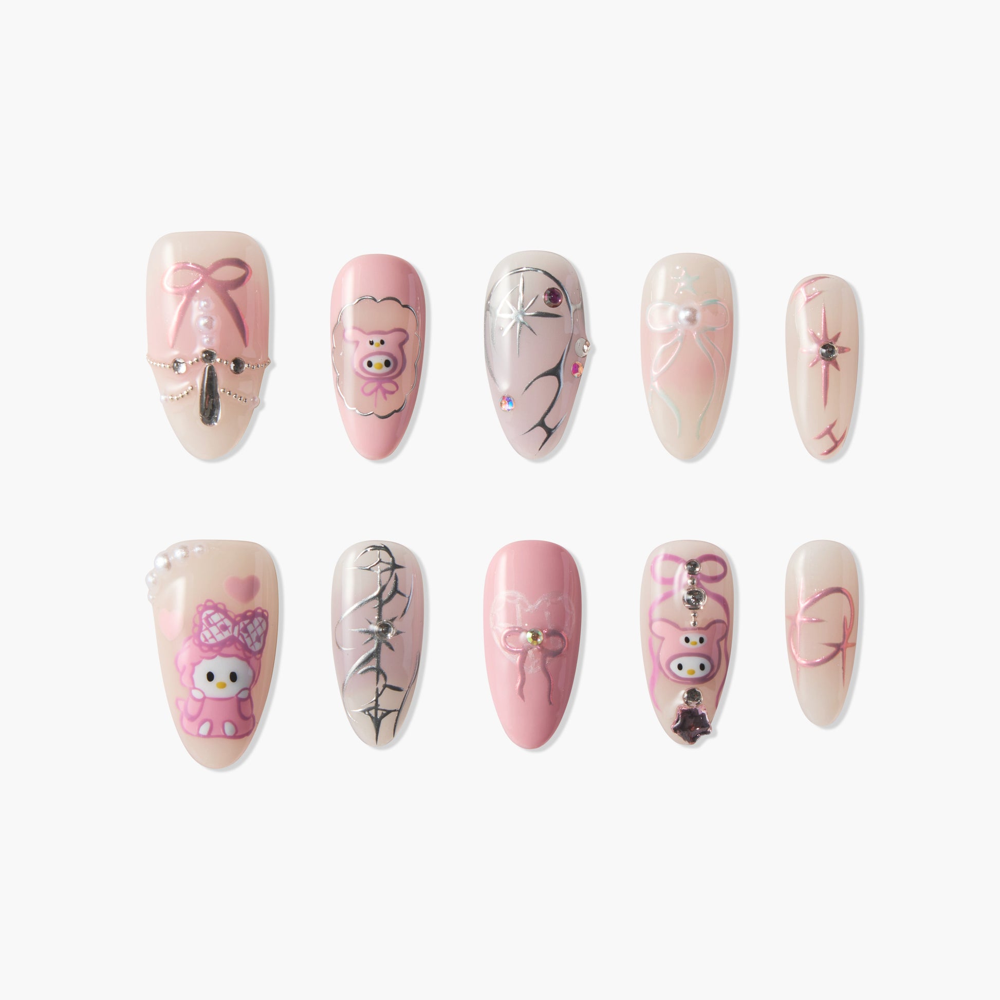 Cute pink press-on nails with cartoon bear, bows, hearts, pearls, and rhinestone accents