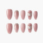 Glossy pink press-on nails with rhinestone and butterfly 3D accents, elegant nail art set